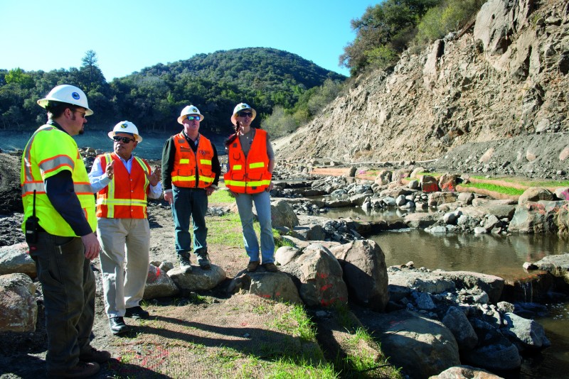 From left, Dylan Wade (engineer for Water Systems Consulting, Inc.), Rashid Ahmad (DWR DSOD retired annuitant), Robert Burns (DWR DSOD engineering geologist), and Kristen Martin (DWR DSOD design engineer) discuss the San Clemente Dam Removal Project and Carmel River Reroute in Carmel Valley, Calif., November 12, 2015. DWRís Division of Safety of Dams (DSOD) visits the San Clemente Dam removal project site as demolition and construction wraps up in Monterey County. The 106-foot tall arch concrete dam was removed from the Carmel River in August of 2015 to eliminate the seismic safety risk it posed. In addition to DSOD Engineers and Geologists reviewing and approving the demolition plan, they inspected the site to ensure stability of the land surrounding the demolished dam and the two new sediment retention structures. Further restoration work is expected in 2016 by the dam owner. For more information, visit http://www.sanclementedamremoval.org/. Florence Low / California Department of Water Resources, FOR EDITORIAL USE ONLY